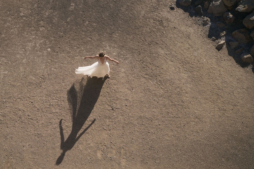 Luxury editorial wedding photography — tulle cape caught in the wind, French Riviera