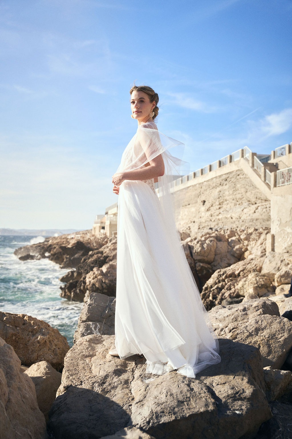 Fashion-forward bridal portrait facing the Mediterranean, destination wedding photographer Provence