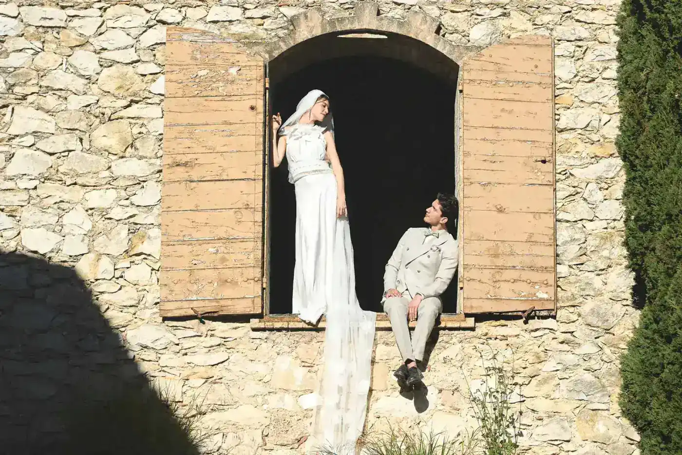 Bride and groom outside a stone mas wedding venue in Provence